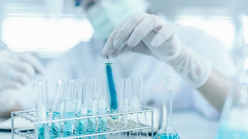 Young,Asian,Scientist,With,Test,Tube,Making,Research,In,Clinical