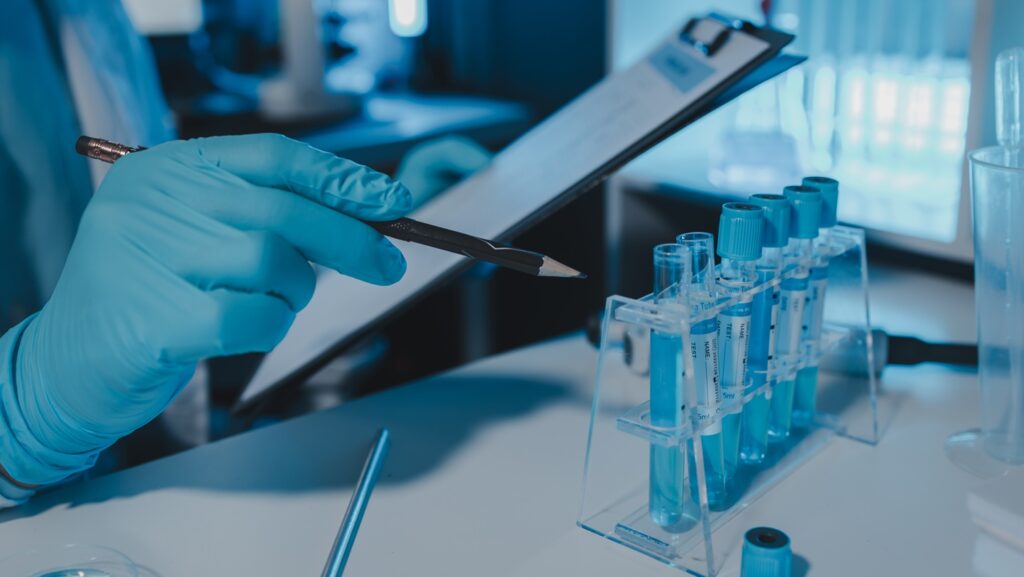 A,Scientist,Is,Working,In,Laboratory,And,Taking,Note,Of