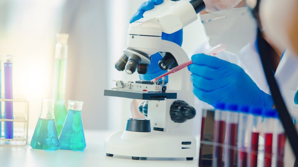 Medical,Or,Scientific,Researcher,Researching,And,Experimenting,Multi-colored,Solution,,Vial