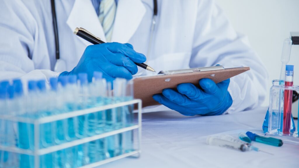 Medical,Or,Scientific,Researcher,Researching,And,Experimenting,Multi-colored,Solution,,Vial