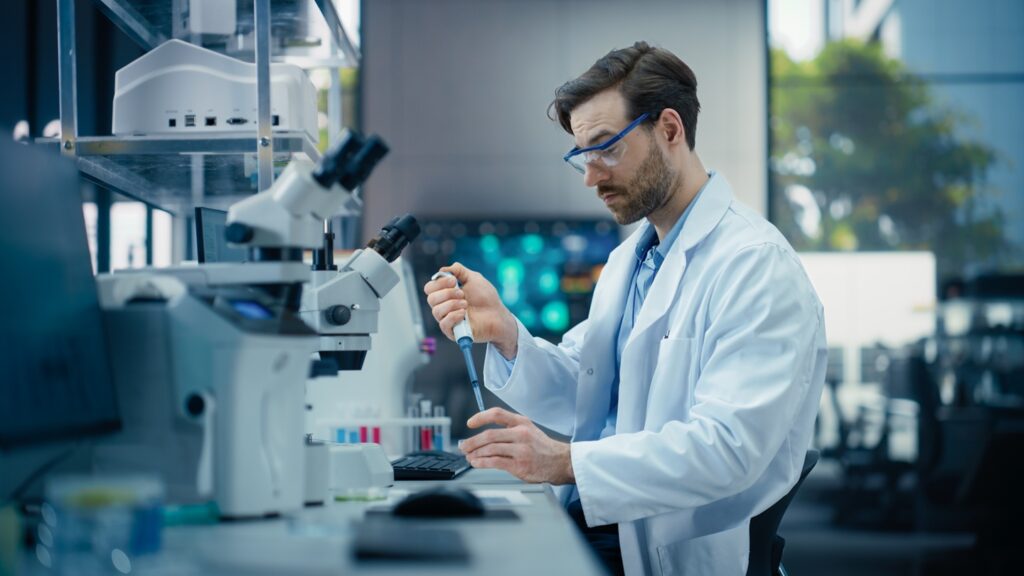 Pharmaceutical,Laboratory:,Young,Male,Scientist,Working,With,Samples,,Using,Micro